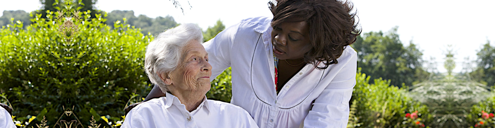 female caregiver and senior woman looking at each other